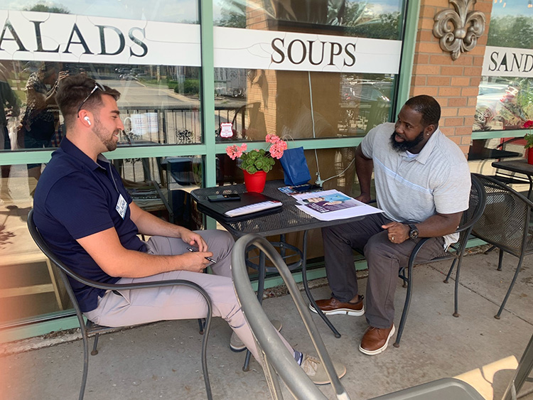 Ambassadors Group, two men having lunch